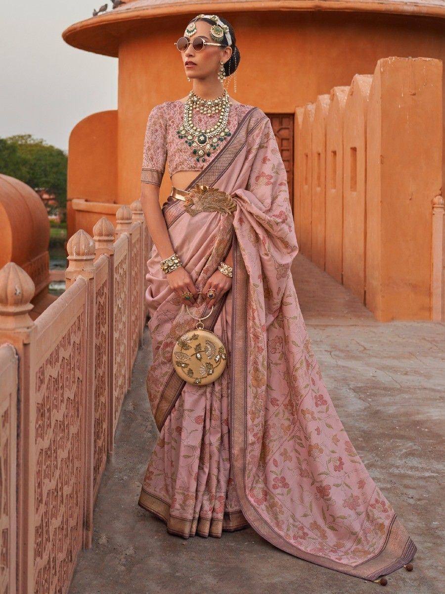Pink floral saree with gold embroidery, traditional Indian ethnic wear, styled with statement jewelry and sunglasses