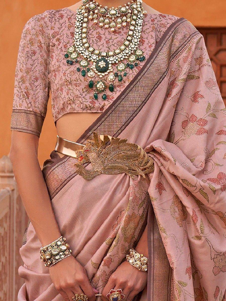 Pink floral saree with designer blouse, peacock belt, and statement jewelry for Indian ethnic wear