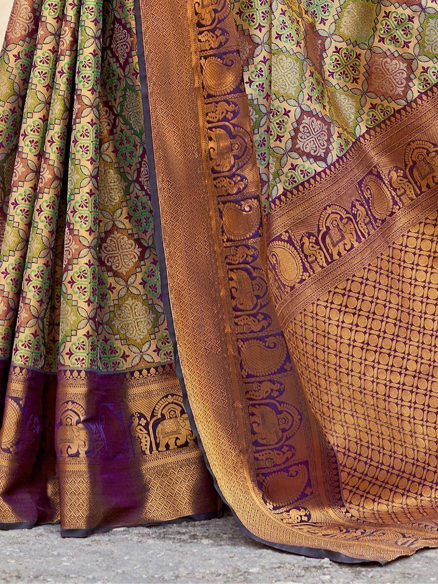 Luxury Indian saree with intricate elephant and floral motifs in gold, green, and purple, perfect for ethnic wear.