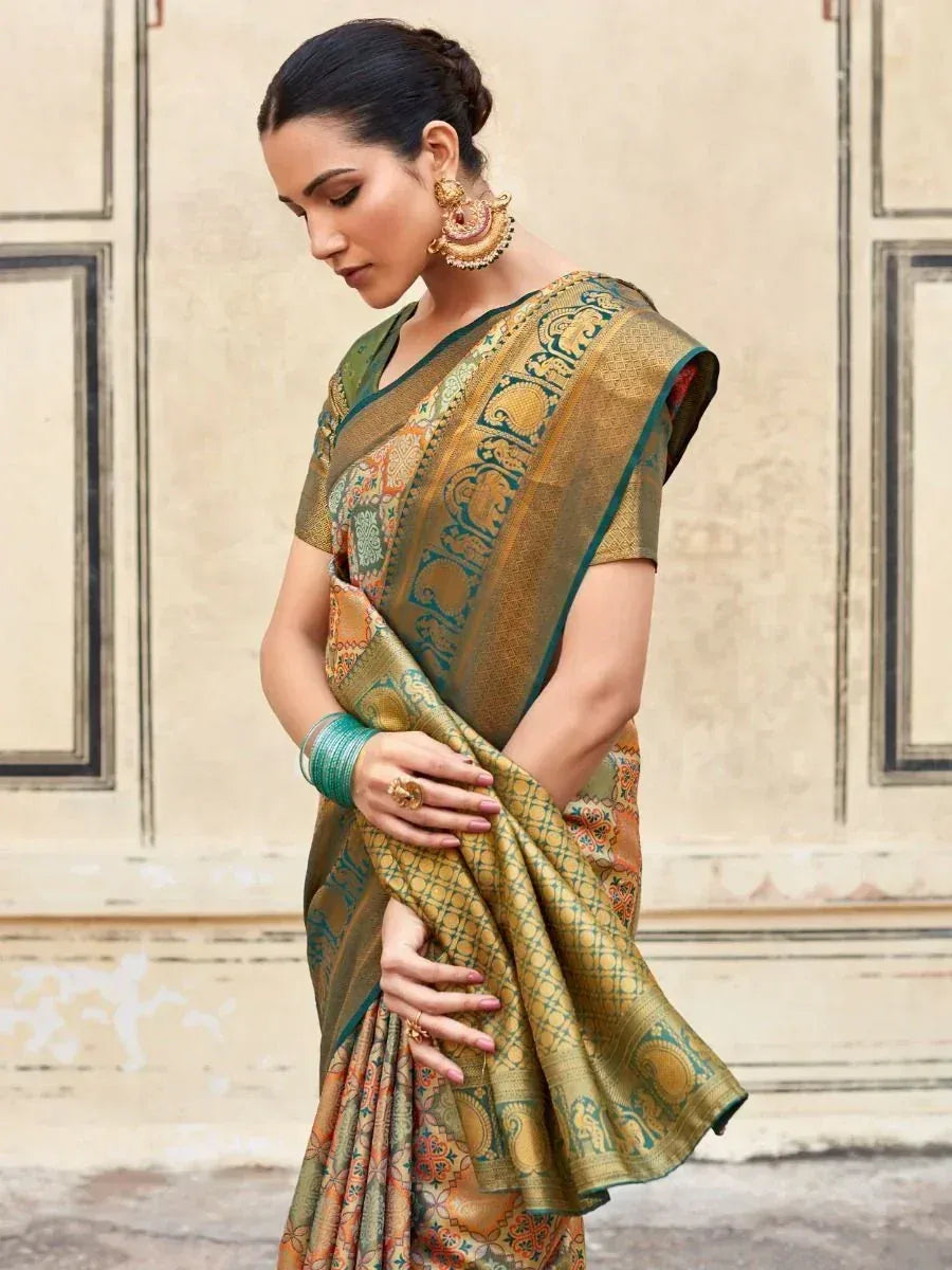 Elegant green and gold designer saree with intricate elephant motifs, perfect for Indian ethnic wear occasions.