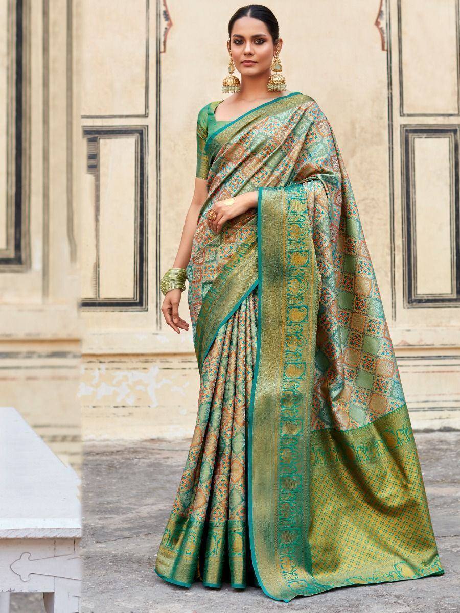 Green and gold designer saree with intricate patterns, perfect for Indian ethnic wear occasions