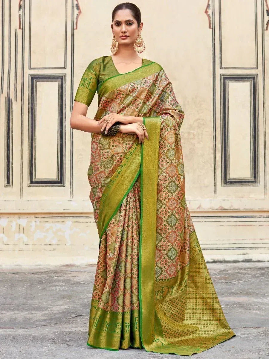 Green and gold designer saree with intricate geometric print, perfect for ethnic occasions