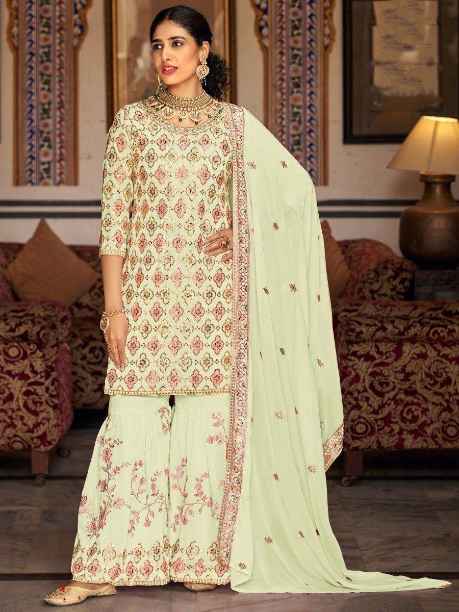 Mint green embroidered salwar kameez with floral patterns and matching dupatta, ideal for ethnic occasions