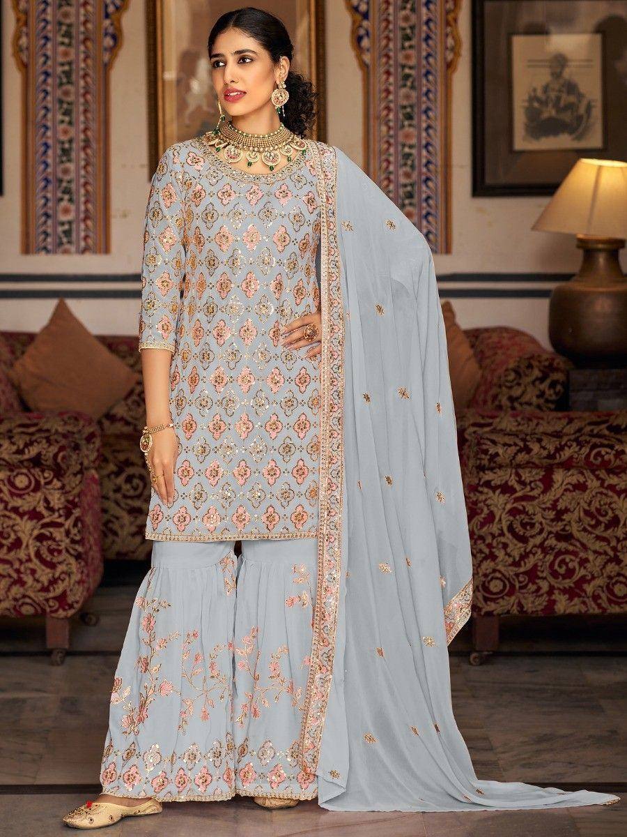 Light blue embroidered salwar kameez with floral motifs and dupatta, perfect for ethnic occasions