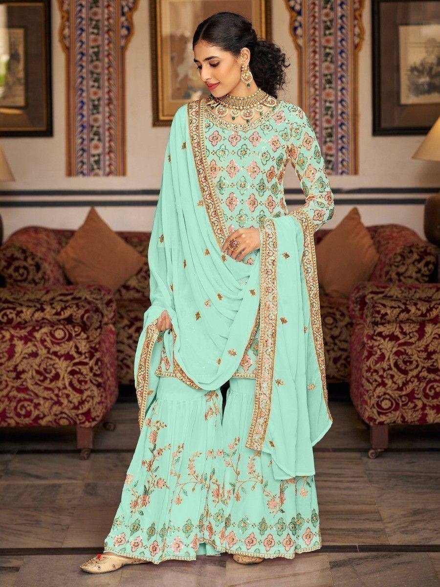 Mint green embroidered sharara suit with floral motifs and gold border, perfect for Indian ethnic occasions