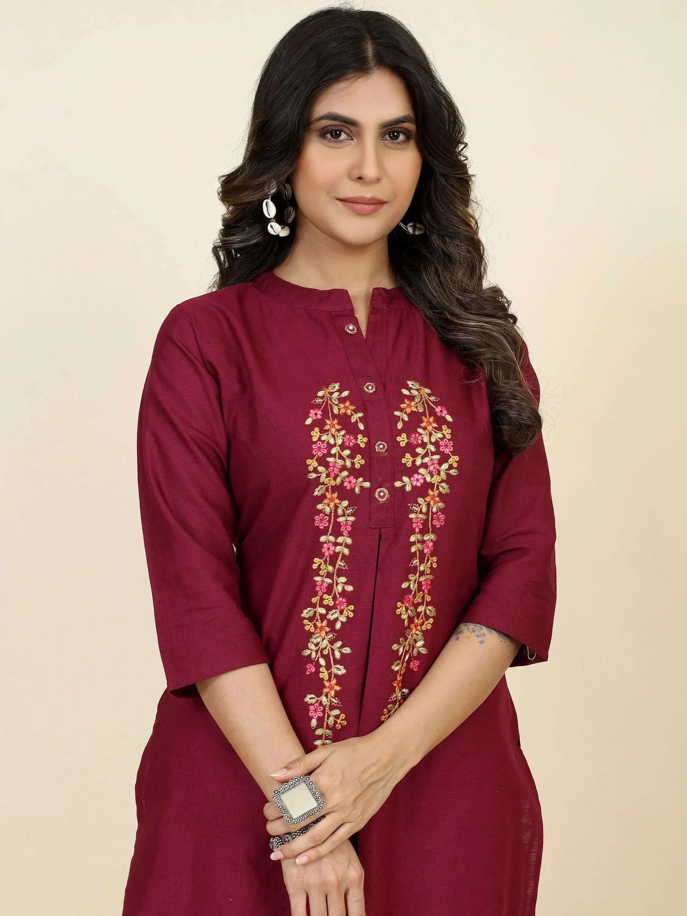 Maroon ethnic kurta with floral embroidery, perfect for Indian wear and festive occasions.