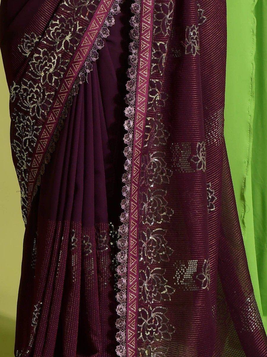 Elegant maroon saree with gold floral embroidery and lace border, perfect for ethnic occasions