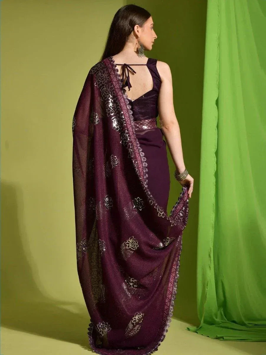 Purple designer saree with silver floral embroidery and lace border, styled with back-tie blouse