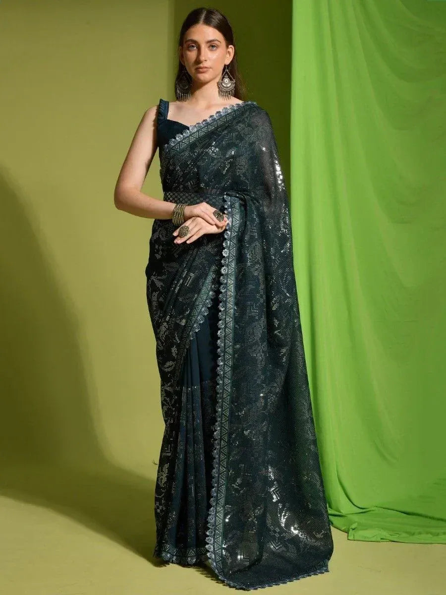 Elegant dark green sequin saree with lace border, perfect for Indian ethnic occasions