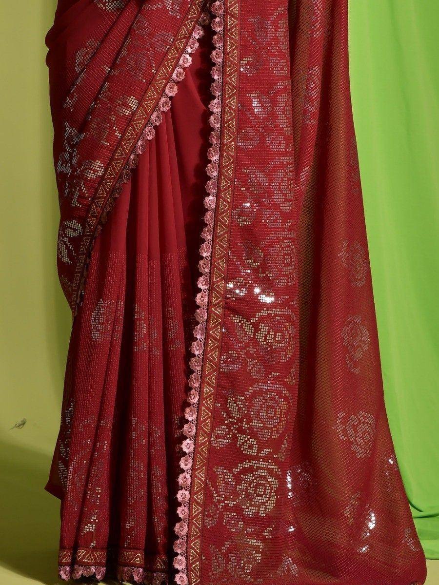 Red sequin saree with floral embroidery and pink lace border, ethnic Indian wear