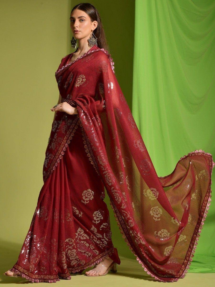 Maroon designer saree with gold floral embroidery and sequin detailing, perfect for Indian ethnic occasions.