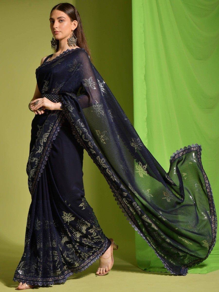 Navy blue designer saree with gold embroidery and sheer pallu, styled for ethnic occasions
