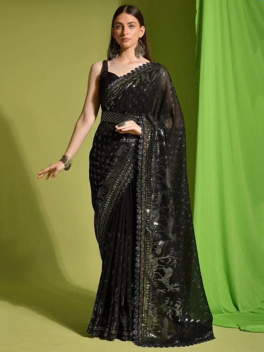 Black sequin saree with embroidered border, styled with sleeveless blouse for ethnic occasions