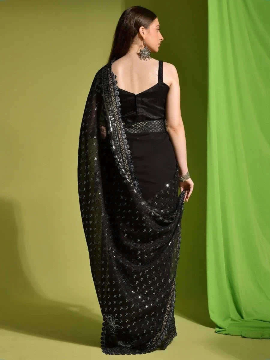 Black sequin saree with lace border, styled with sleeveless blouse, ethnic wear for women