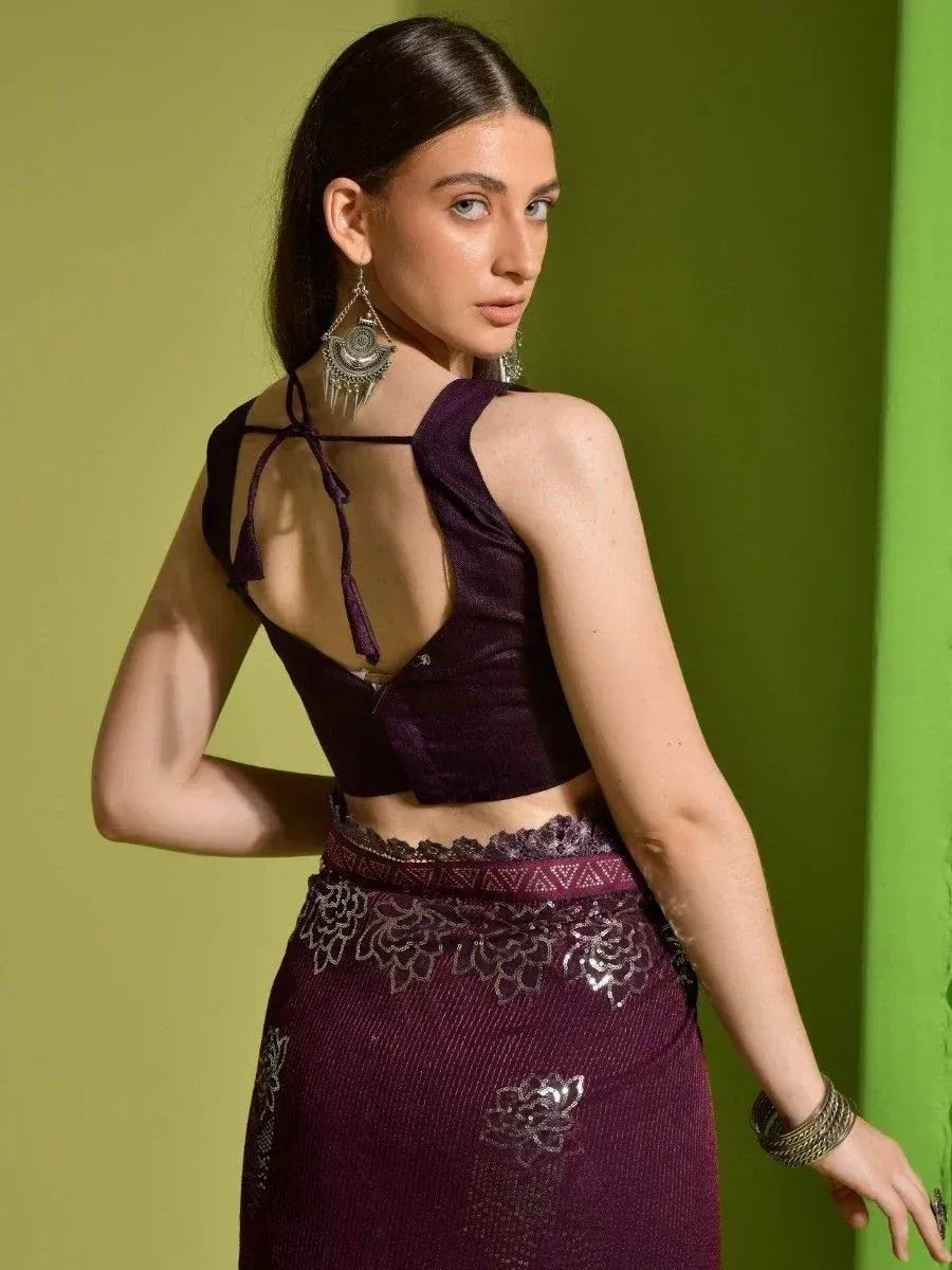 Purple ethnic lehenga choli with back tie blouse and floral embroidery, styled with jhumka earrings