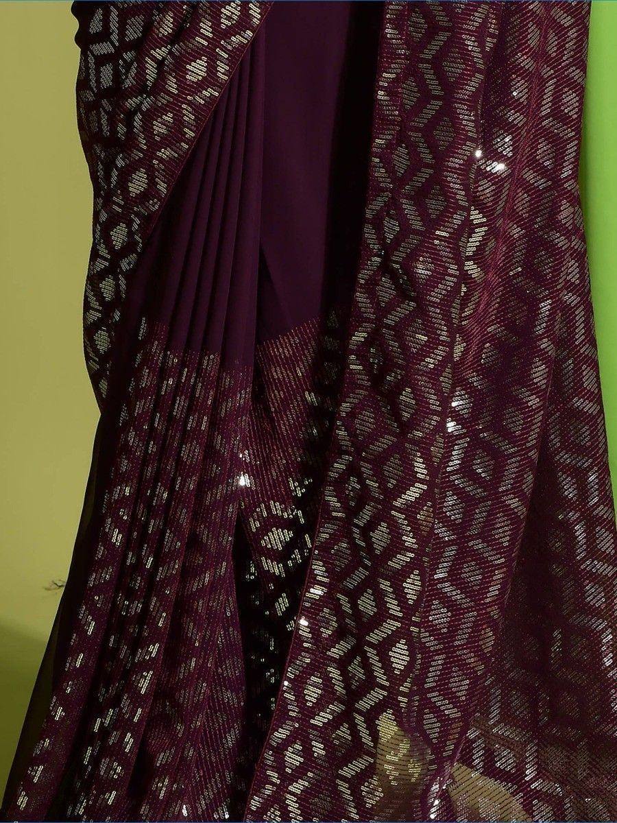 Purple ethnic saree with silver sequin embroidery and geometric patterns, ideal for festive occasions