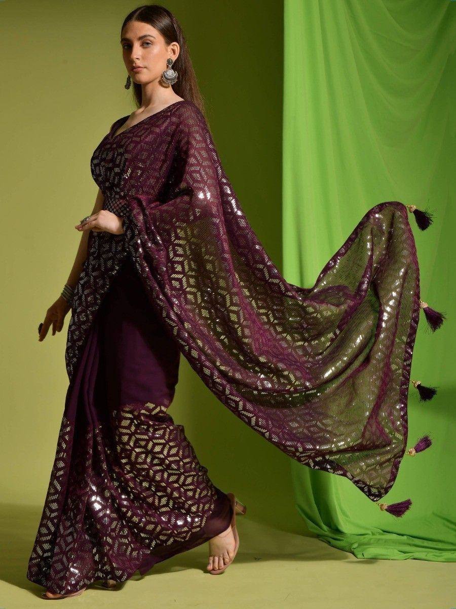 Elegant purple designer saree with sequin geometric pattern and tassels, perfect for Indian ethnic wear occasions.