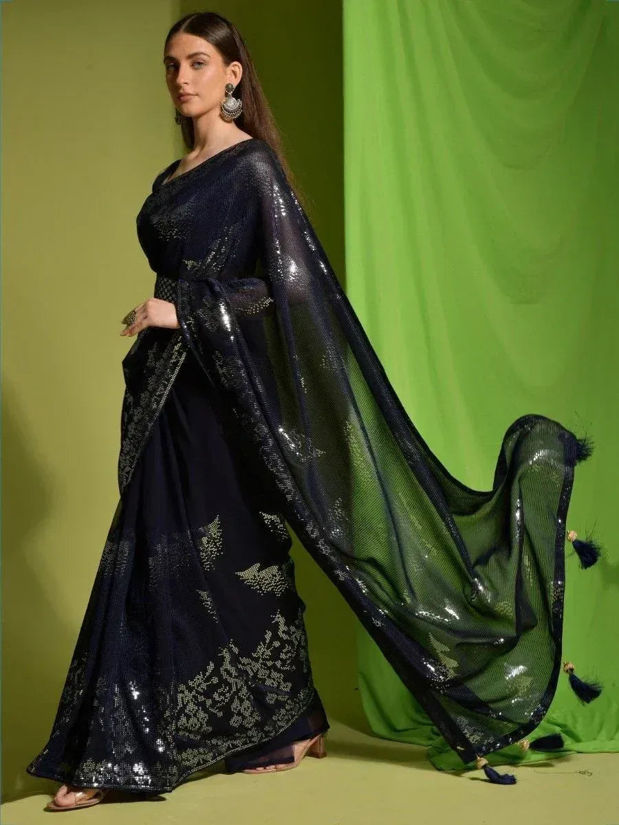 Navy blue sequin saree with gold embroidery and tassel border, elegant ethnic wear for women