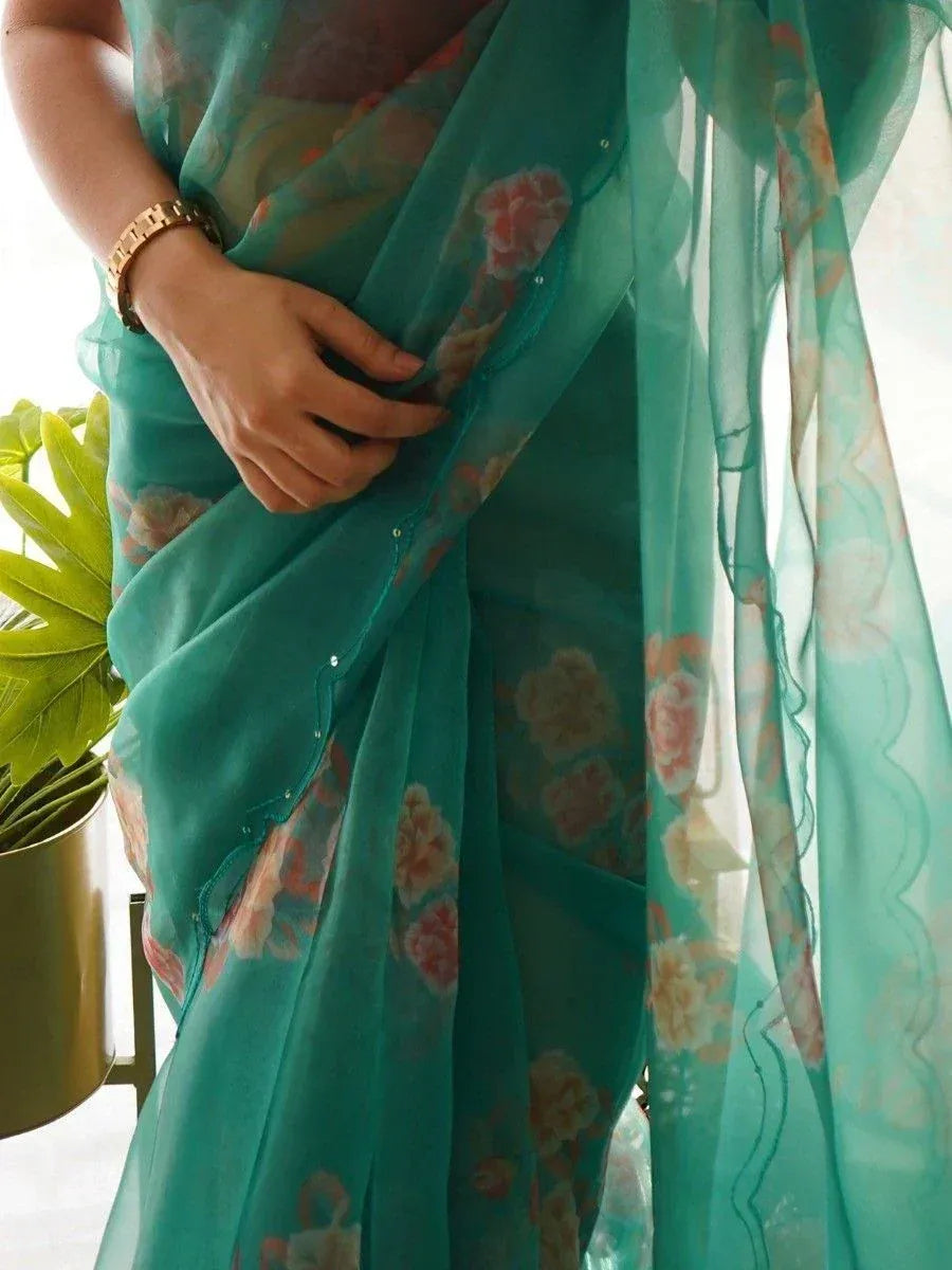 Teal floral saree with sheer pallu, perfect for Indian ethnic wear occasions
