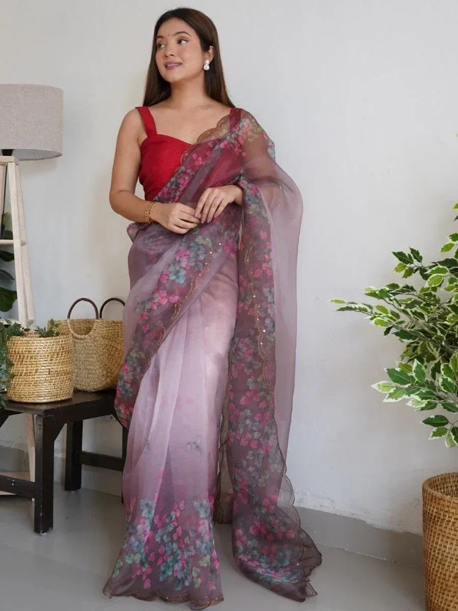 Woman in floral print sheer saree with red blouse, ethnic Indian wear for festive occasions