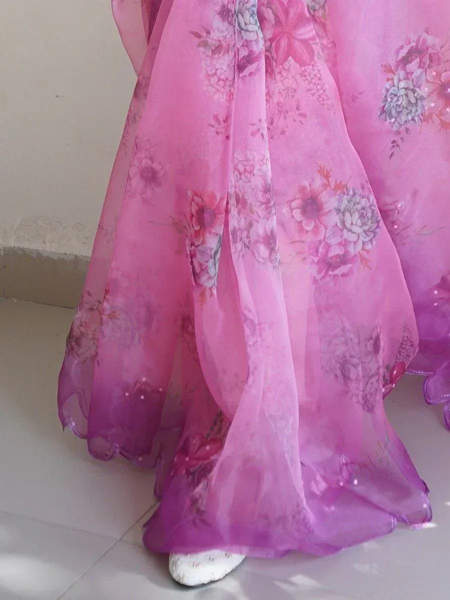 Pink floral ethnic gown with sheer overlay and sequin details, perfect for festive occasions