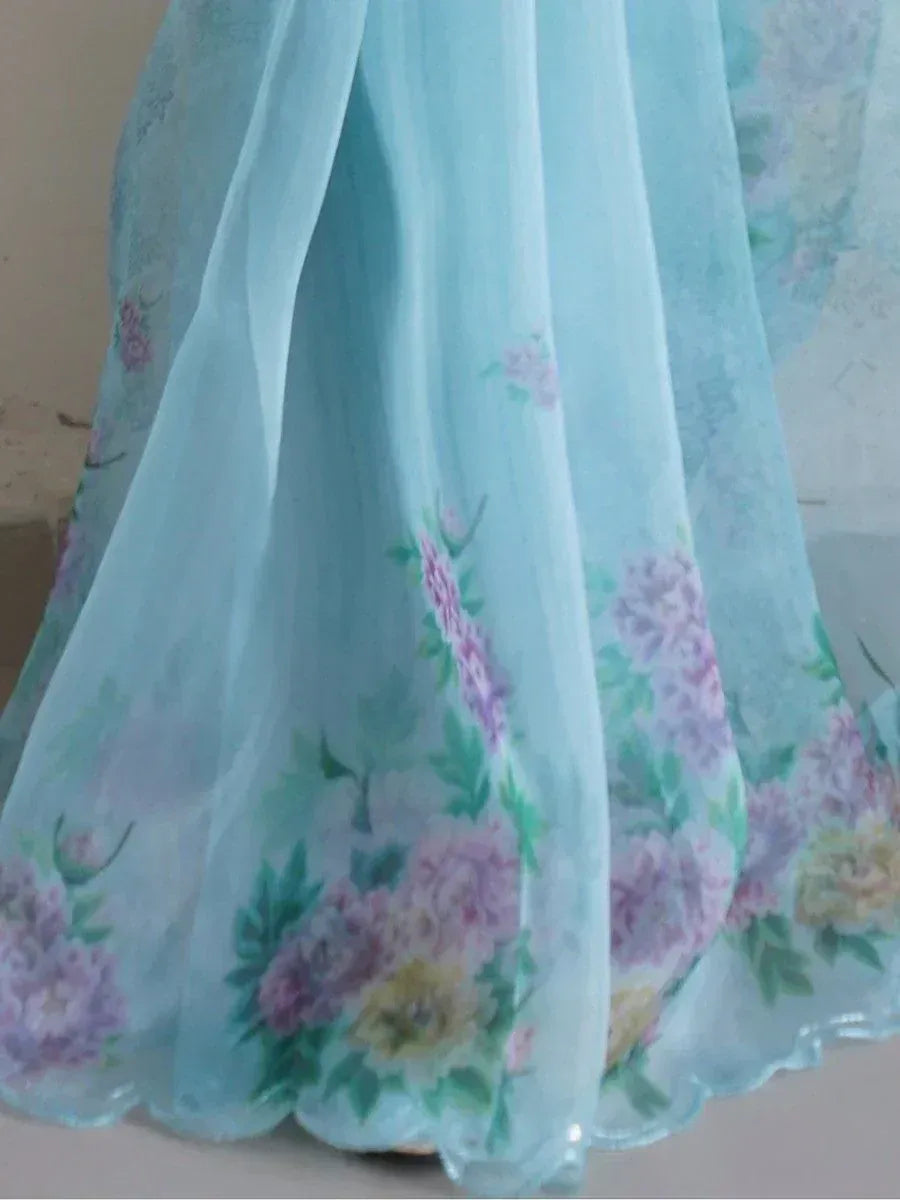Light blue floral print ethnic gown with sheer fabric and scalloped hem