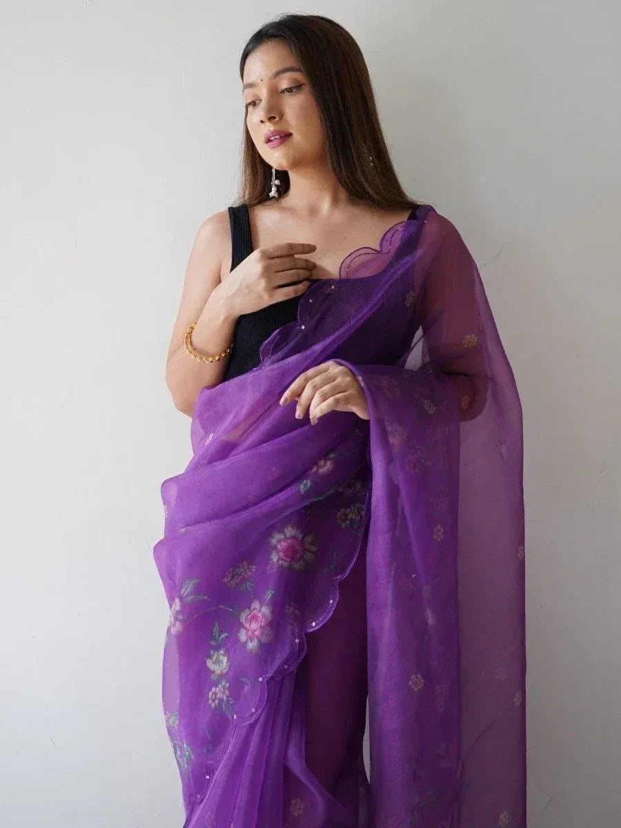 Purple floral saree with scalloped border, styled with black blouse for ethnic wear
