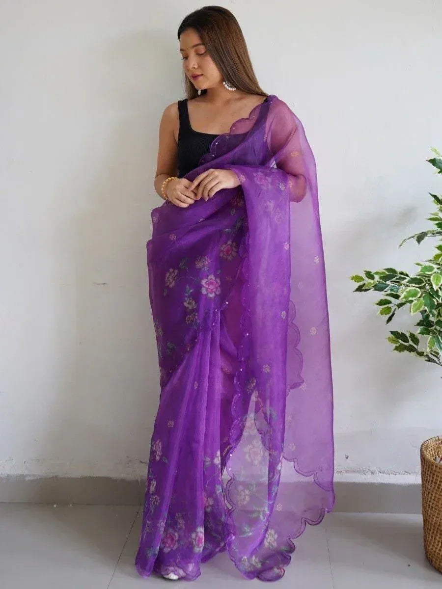 Purple floral embroidered saree with scalloped border, styled with black blouse for ethnic wear