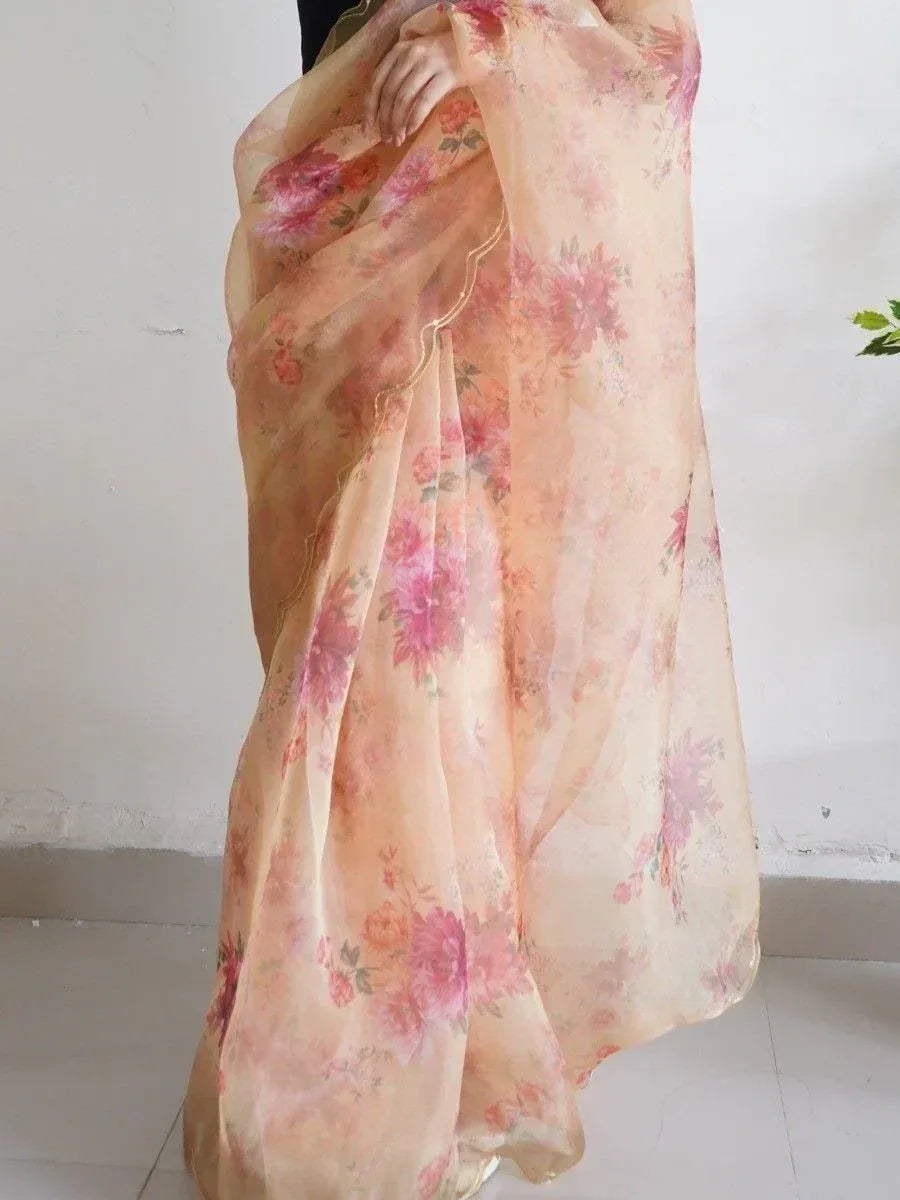Floral print peach saree with gold border, elegant Indian ethnic wear for women