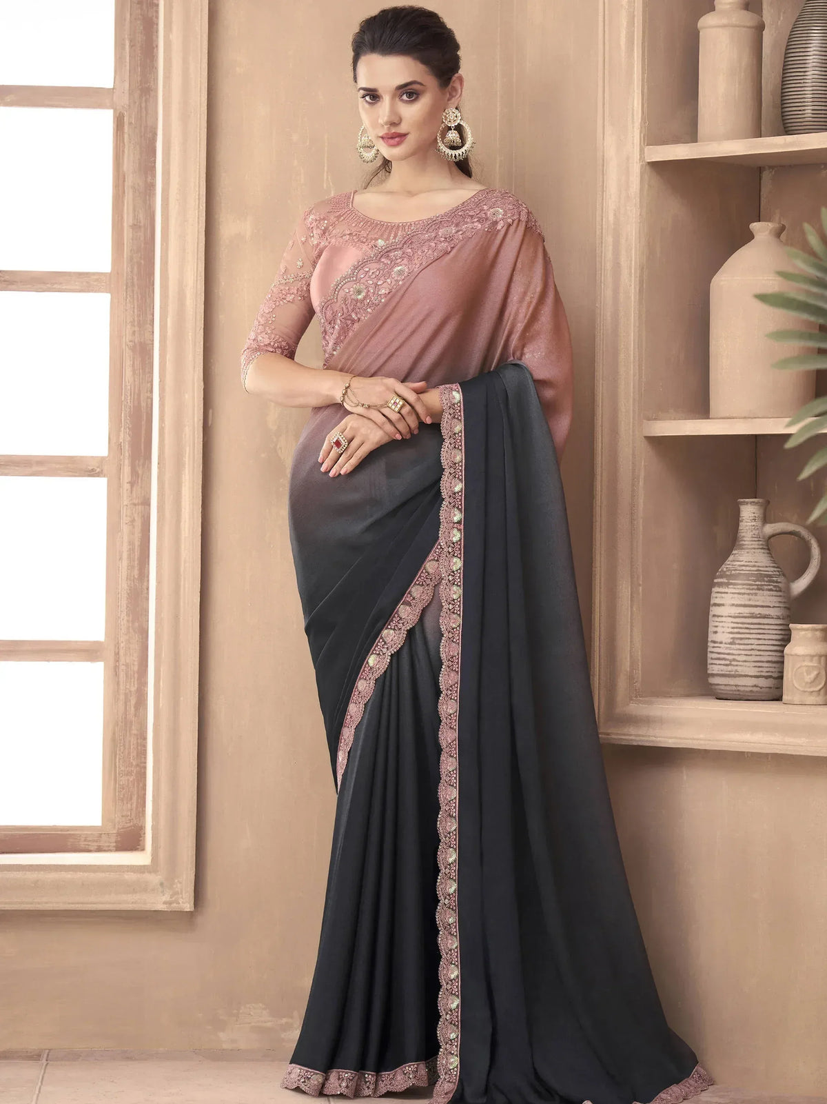 Elegant black saree with pink embroidered blouse, perfect for Indian ethnic occasions