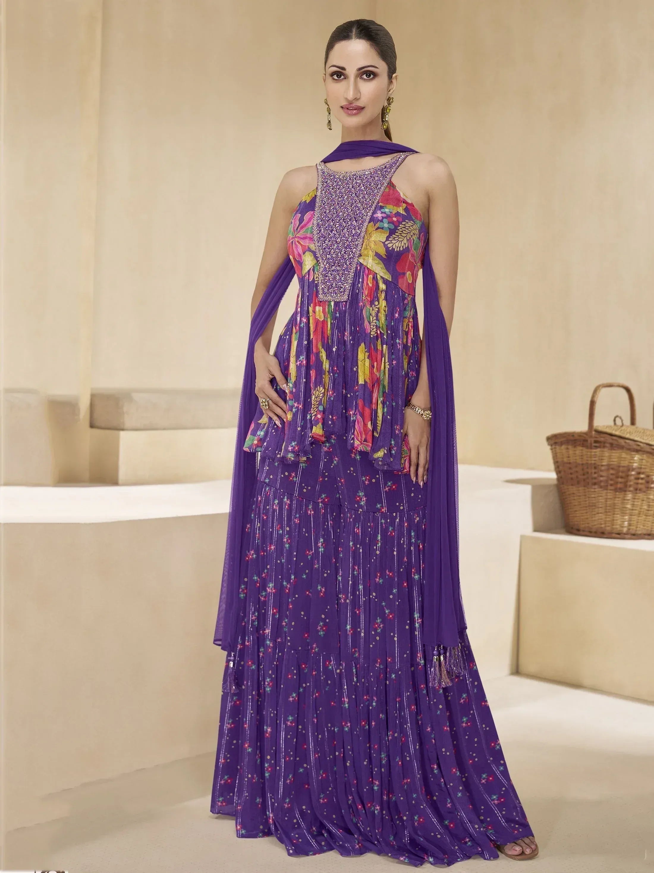 Purple floral print ethnic gown with embroidered neckline and pleated skirt, perfect for Indian occasions