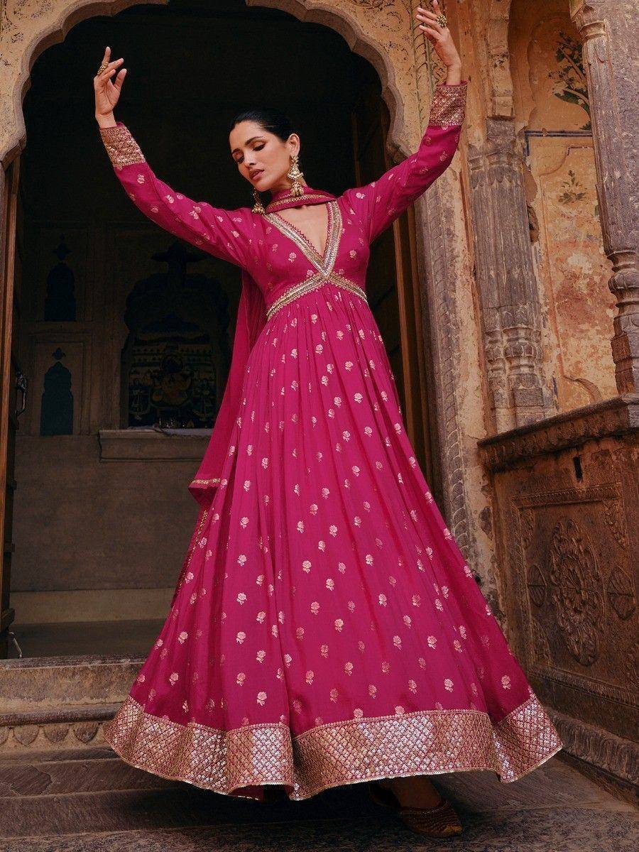 Pink ethnic anarkali gown with gold embroidery, perfect for Indian weddings and festive occasions