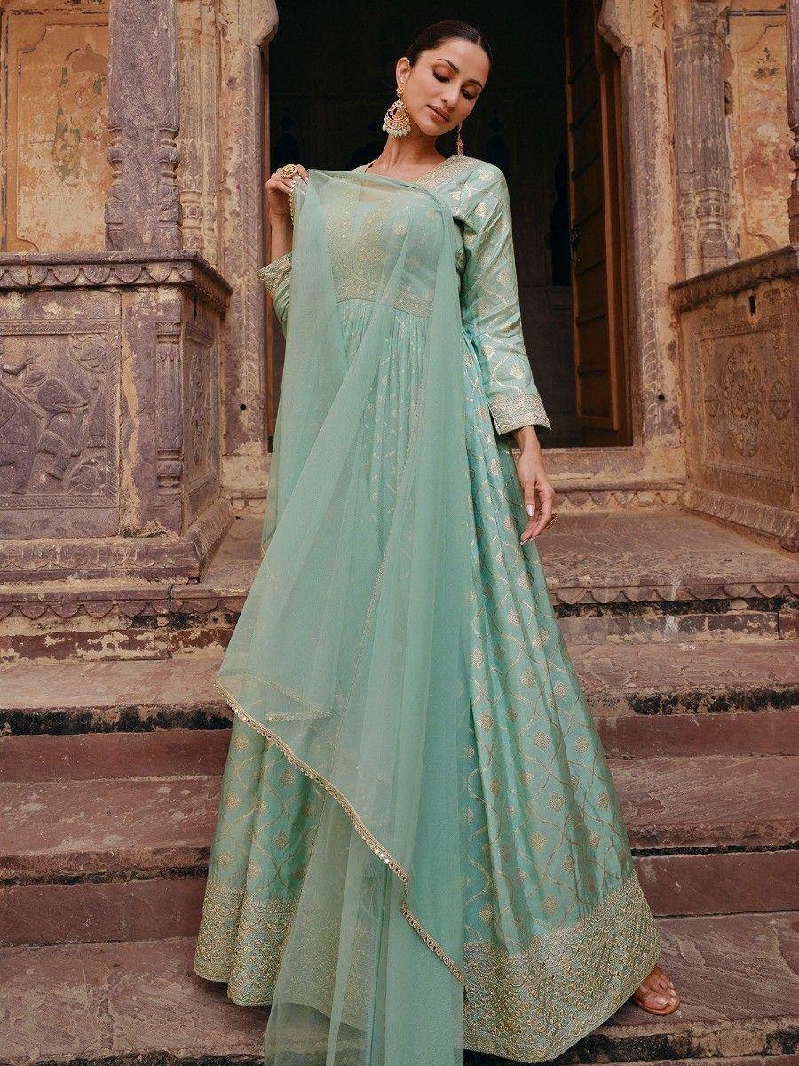 Mint green designer anarkali with gold embroidery, perfect for Indian ethnic wear occasions