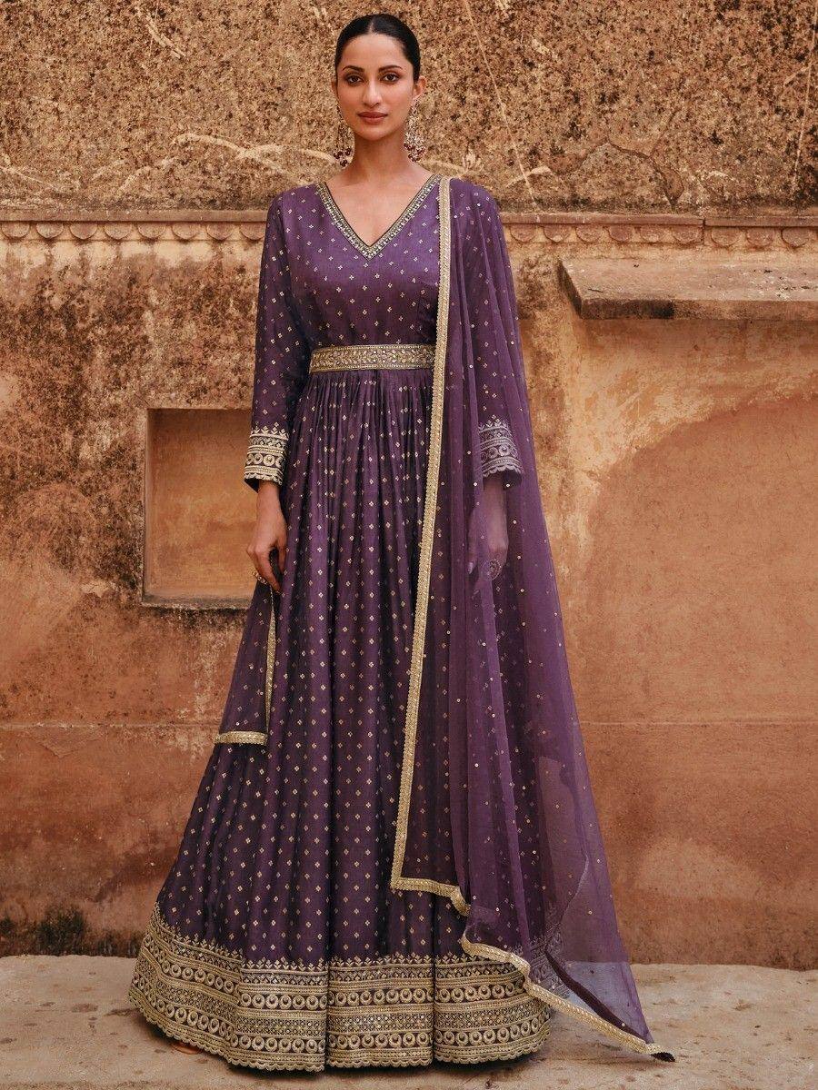 Purple ethnic anarkali gown with gold embroidery, perfect for Indian weddings and festive occasions.