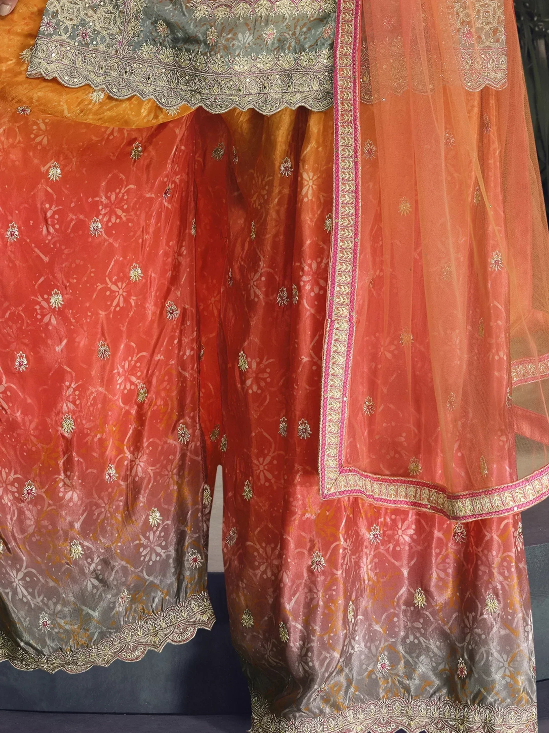Orange and grey embroidered Indian ethnic salwar kameez with floral motifs and scalloped dupatta border
