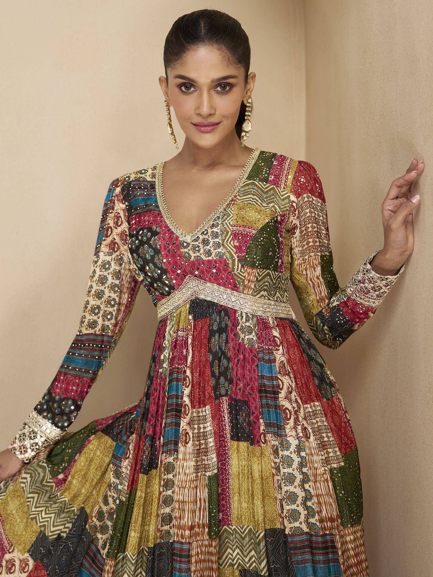 Woman in colorful patchwork ethnic gown with embroidery, perfect for Indian festive occasions