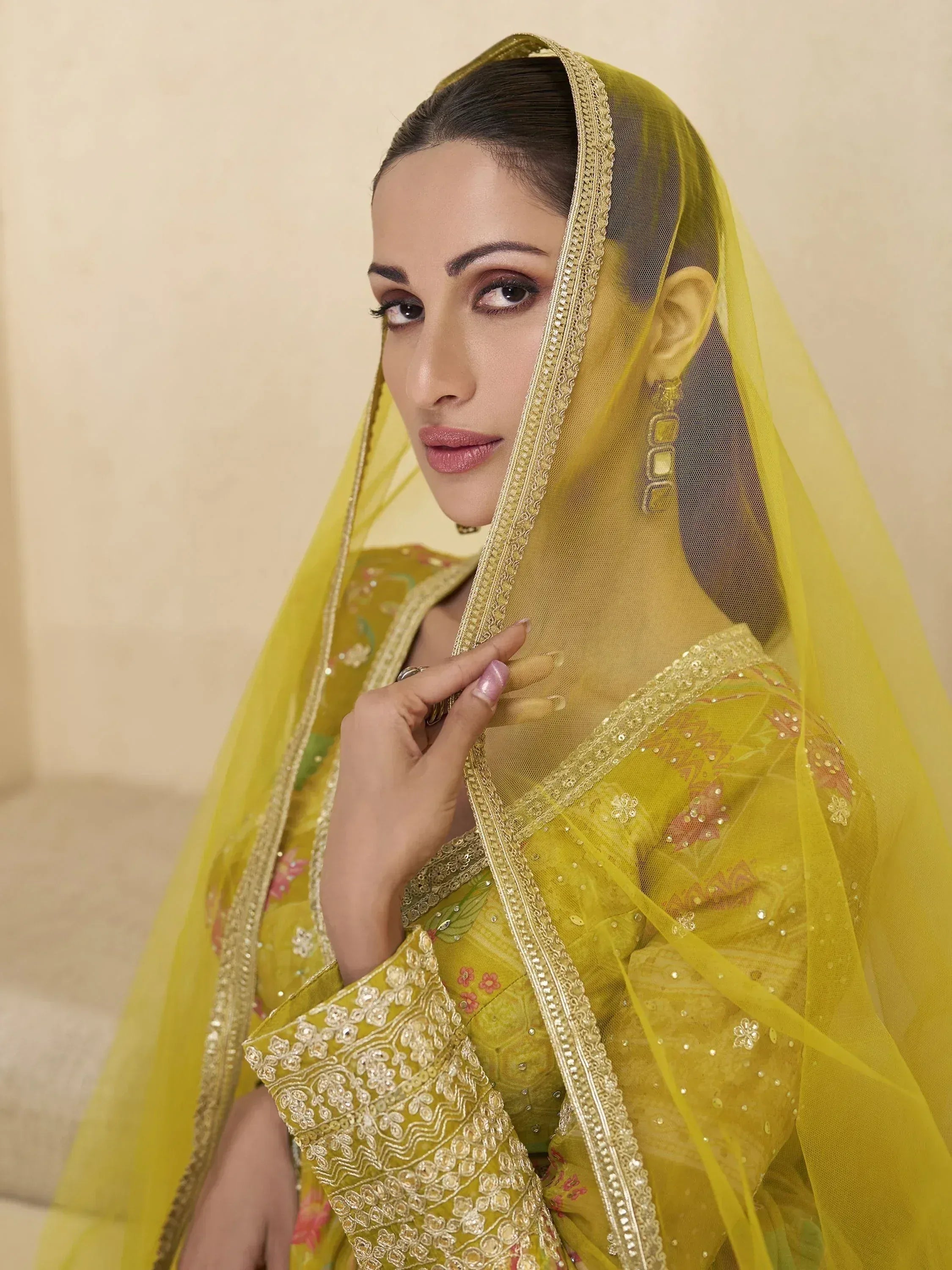 Yellow embroidered ethnic suit with sheer dupatta, perfect for Indian weddings and festive occasions