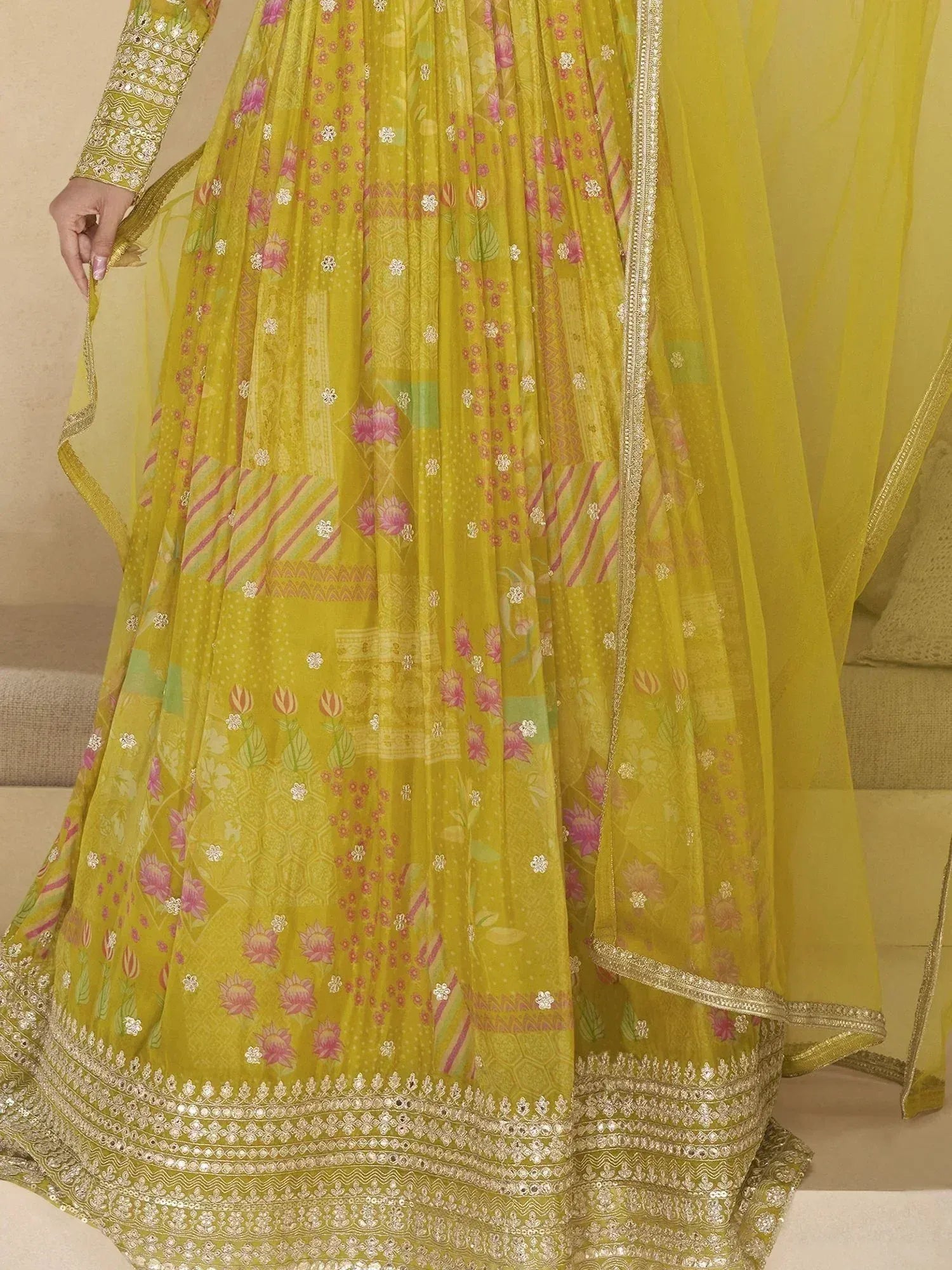 Yellow floral print lehenga choli with gold embroidery and sheer dupatta, ethnic Indian wear