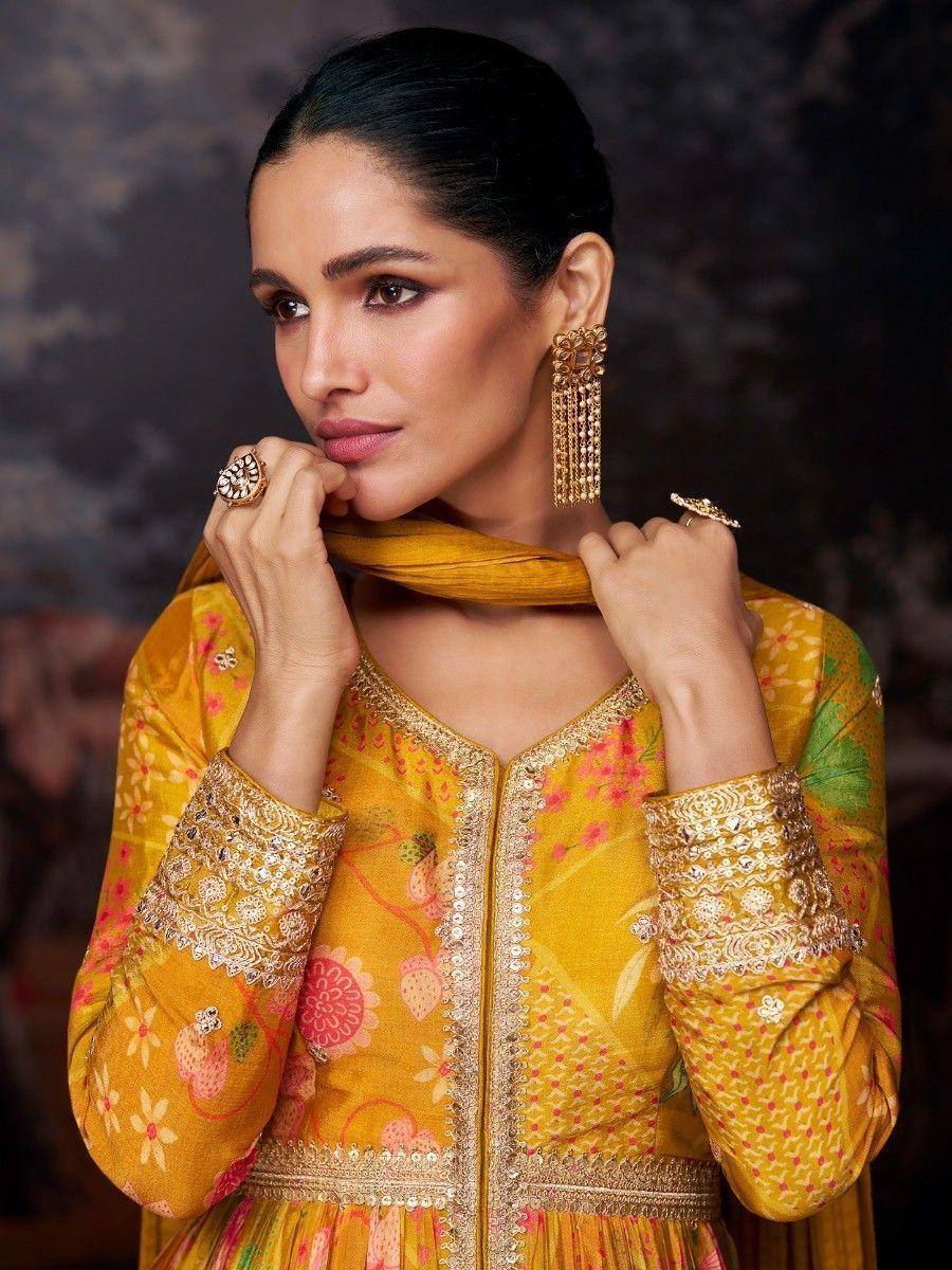 Yellow floral embroidered ethnic gown with gold detailing, perfect for Indian festive occasions