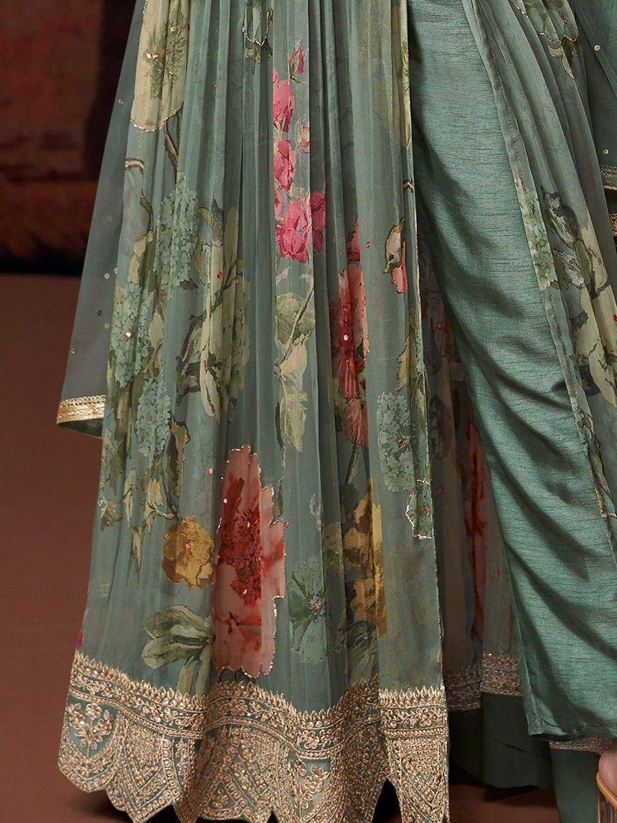 Elegant teal lehenga with floral prints and golden embroidery, perfect for ethnic occasions.