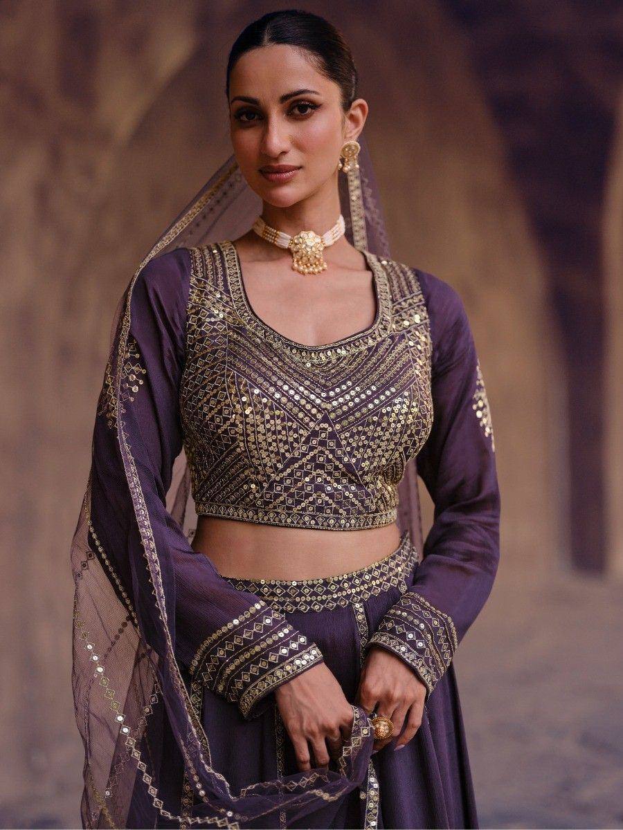 Purple ethnic lehenga choli with gold mirror work, perfect for Indian weddings and festive occasions