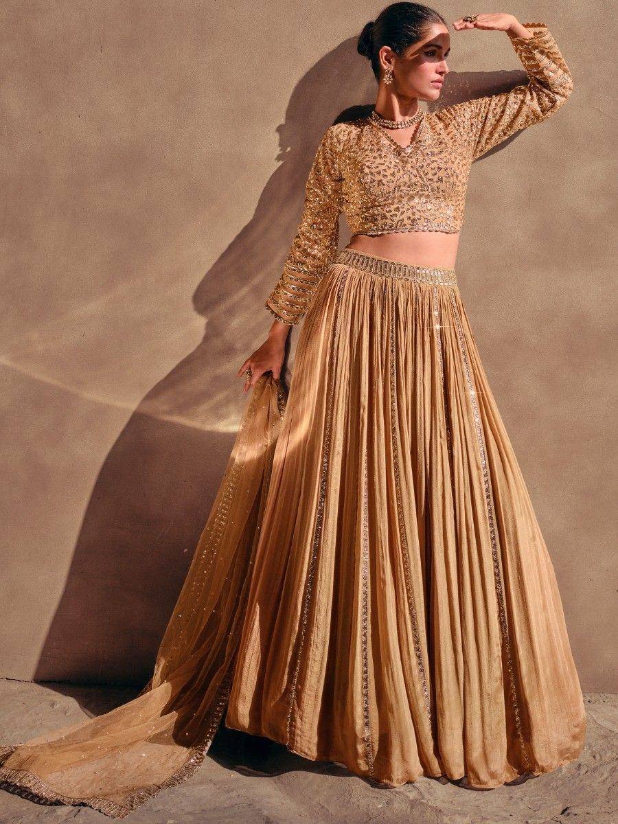 Golden embroidered lehenga choli with pleated skirt, perfect for Indian ethnic wear events