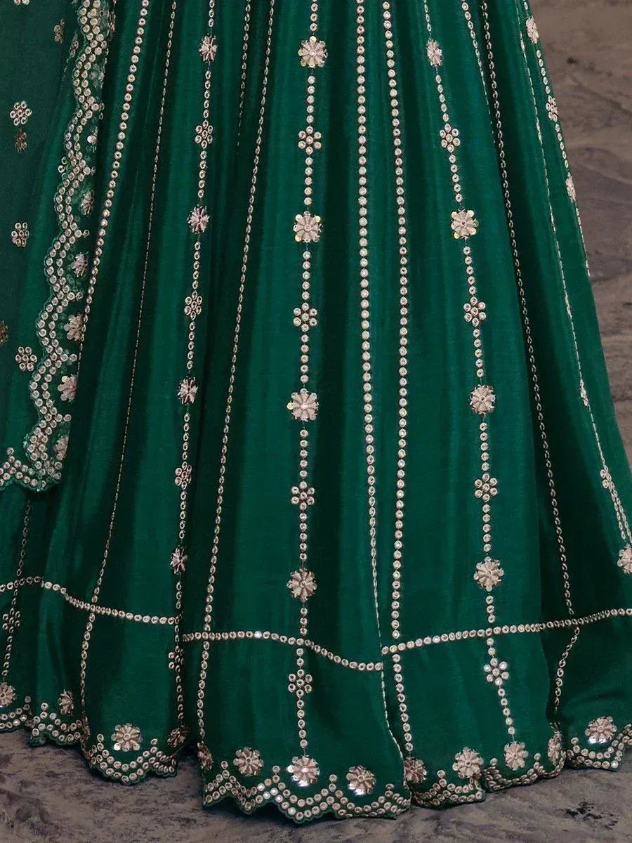 Emerald green velvet lehenga with intricate floral embroidery and sequin detailing for Indian ethnic wear