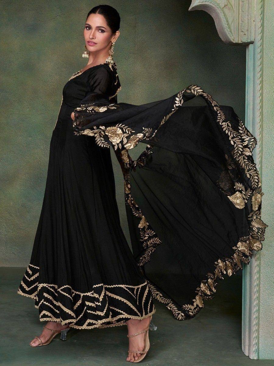 Black ethnic gown with gold floral embroidery, perfect for Indian occasions and festive wear.
