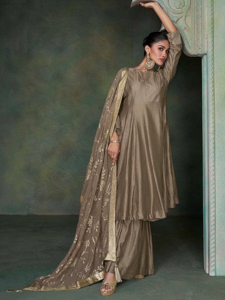 Elegant beige designer salwar kameez with gold embroidered dupatta, perfect for ethnic occasions