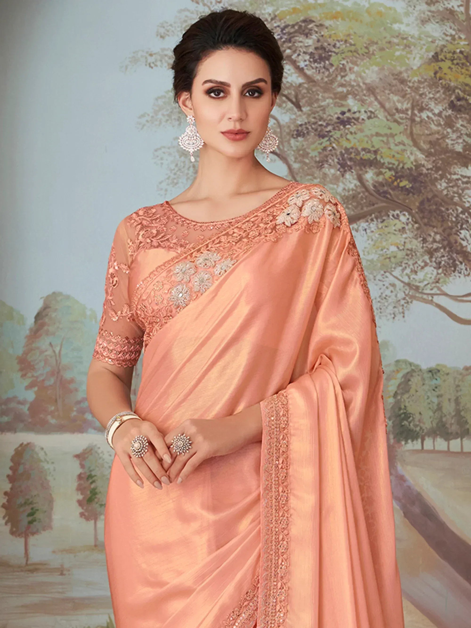 Elegant peach saree with floral embroidery and sequin work, perfect for Indian ethnic occasions