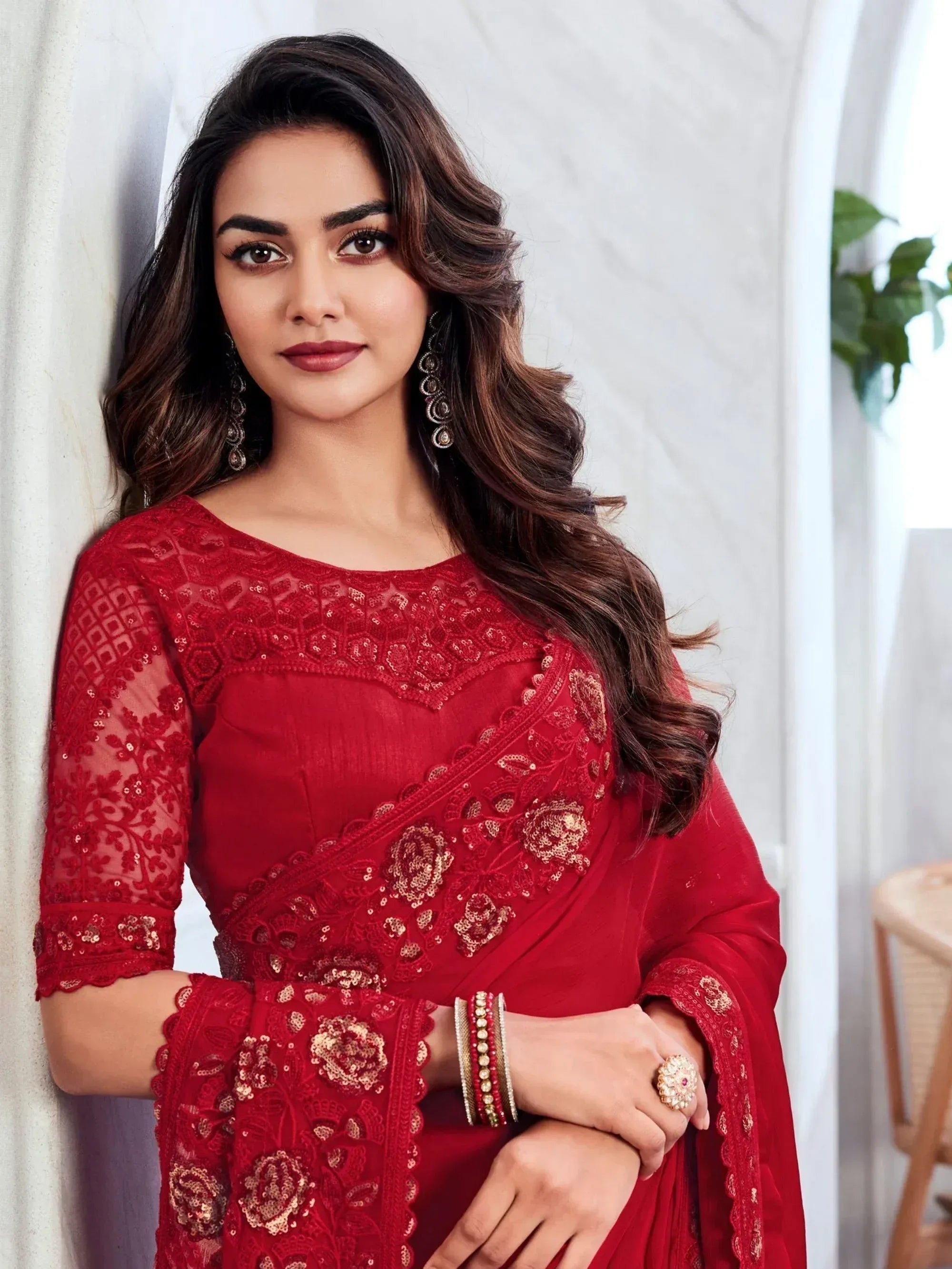 Red embroidered ethnic saree with lace and sequin detailing, perfect for Indian occasions