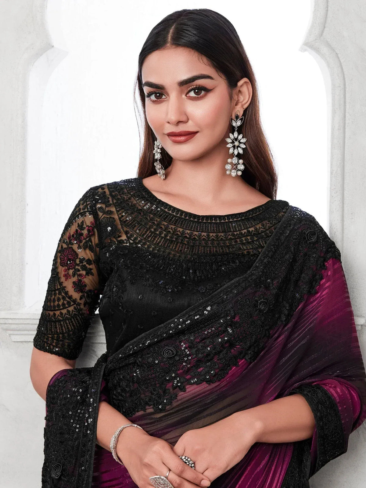 Elegant black and purple saree with floral embroidery and sequins, perfect for Indian ethnic wear occasions.