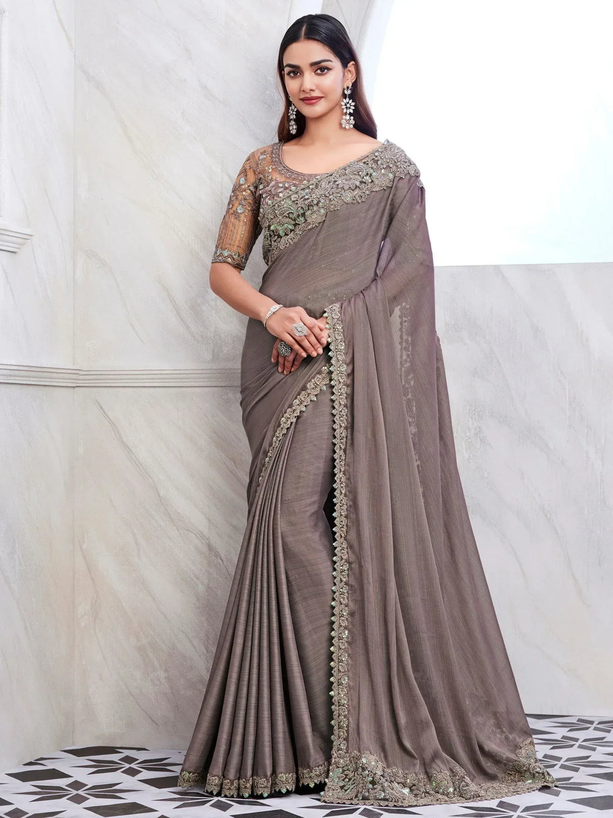 Elegant grey designer saree with intricate embroidery and embellished border, perfect for Indian ethnic occasions.