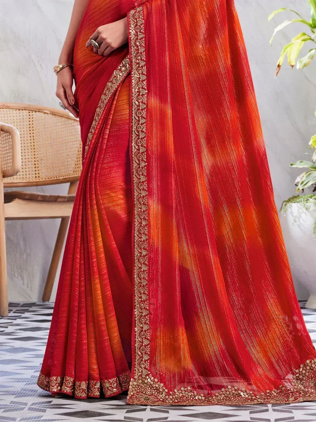 Red and orange designer saree with gold embroidery, perfect for ethnic occasions